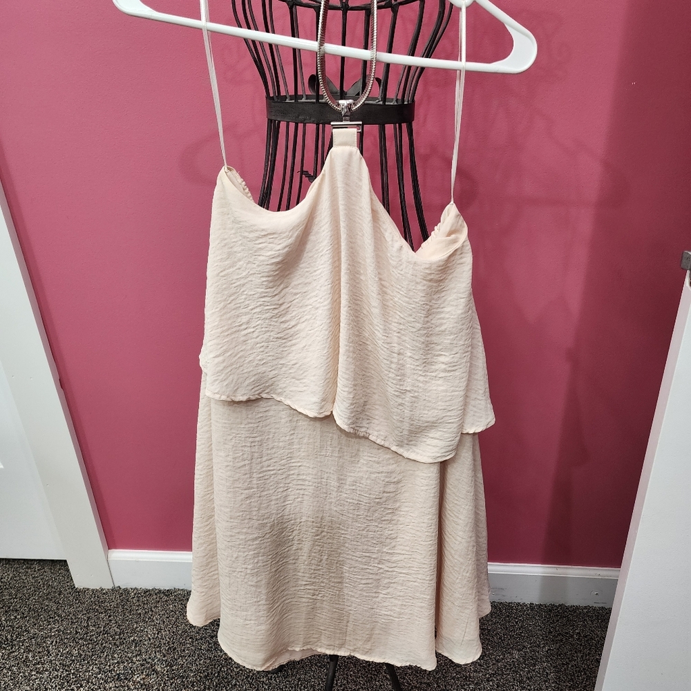 Sleeveless, backless,  summer dress with decorative neck strap.